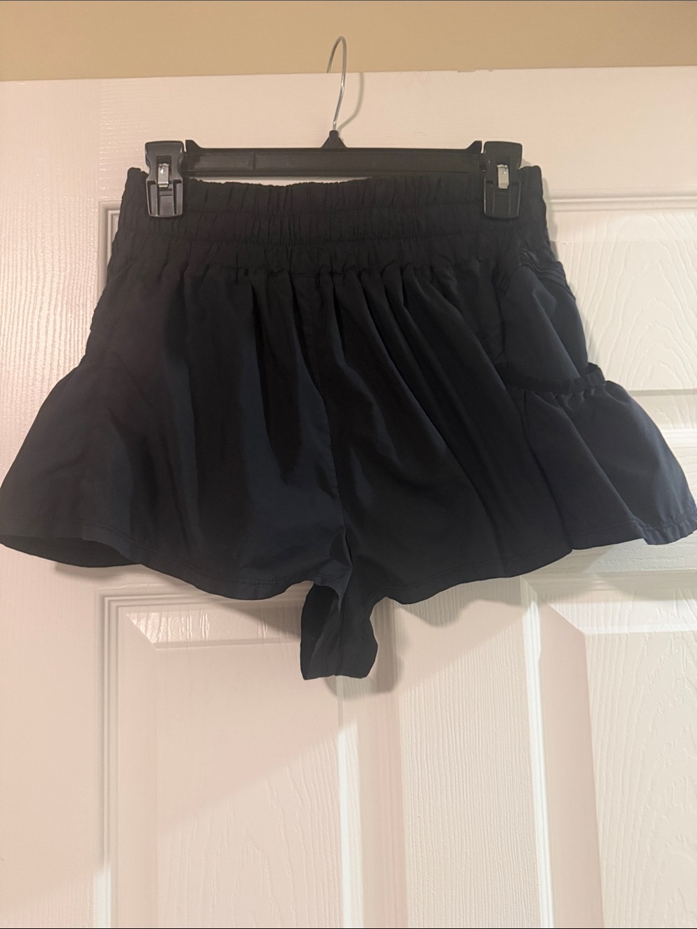 Women’s Black Smocked-Waist Flutter Shorts